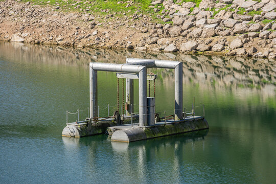 Floating intake pontoon pumping station in water reservoir Asturias Spain