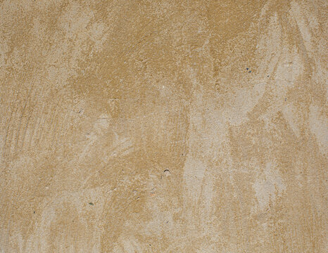 Abstract beige concrete texture with subtle variations, stains and natural surface imperfections. Neutral architectural background for minimalist design and construction concepts.