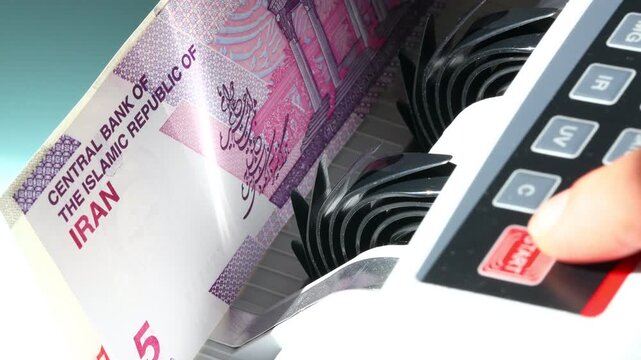 Iranian money. Economic and trade concept. A counter adds one banknote at a time. Business and financial background. Close up
