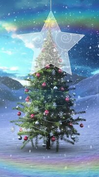 Animation of rainbow lens flare and snow falling over hanging decorations and christmas tree