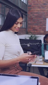 Animation of data processing over woman using a smartphone at office