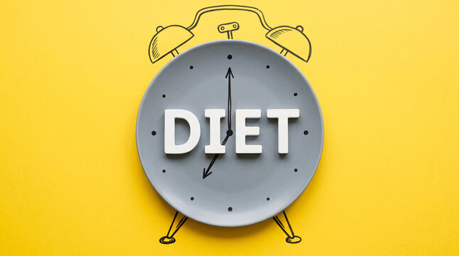 minimalist yellow analog alarm clock with bold diet text, flat vector design, gray and black details