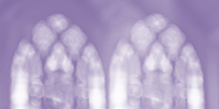 soft effect of bokeh blur stained glass windows in muted purple
