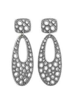 Pair of elegant silver dangle earrings with a unique textured hole pattern for women fashion isolated on transparent background