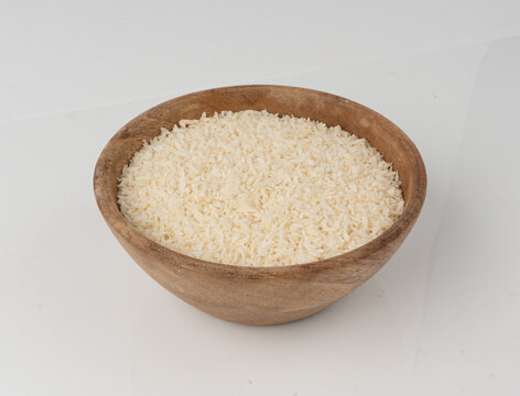 Grated coconut powder. Dry coco flakes pile, shredded desiccated coconut, tropical fruit chips