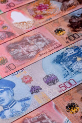 Brunei paper money, dollar banknotes and sen coins as currency for exchange or travel. Brunei money © chernikovatv