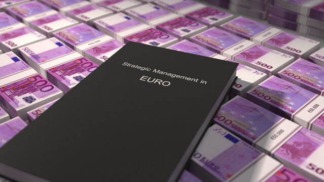 Strategic management in Euro book on top of five hundred euro bill bundles
