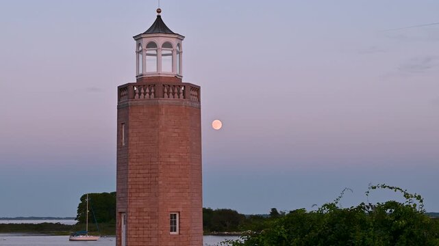 Groton, Connecticut, USA &ndash; Avery Point Lighthouse and Sturgeon Moon at Blue Hour