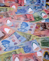 Brunei paper money, dollar banknotes and sen coins as currency for exchange or travel. Brunei money © chernikovatv