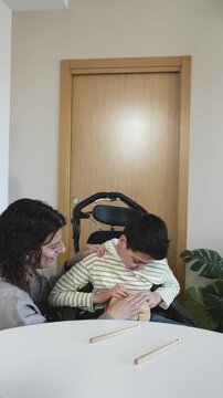 Mother assisting child with sensory music therapy