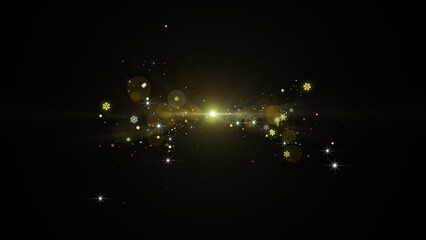 Bright golden optical flare with bursting magic particles on black © Uvindu