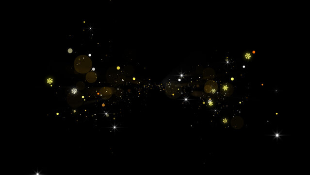 Golden magic dust particles and bokeh glowing on black background