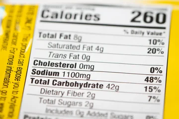 Fotobehang Sportwinkel Nutrition facts label on a packaged instant noodle ramen, highlighting high sodium content.  © Kenishirotie