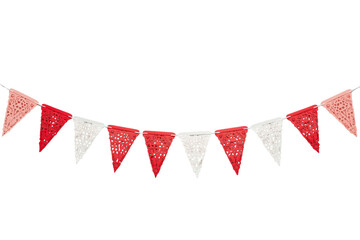 Fototapeta premium Red and white decorative pennant bunting on a curved string