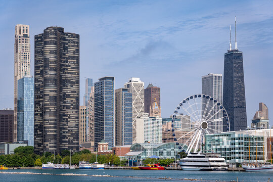 The Chicago skyline and Navy Pier's Centennial Wheel, as a 100 million dollar pier renovation draws debate over public spending priorities, Chicago, Illinois, July 2026.
