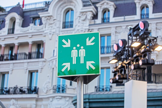 Green square sign indicating the assembly point for evacuation in the city