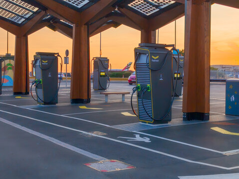 Fastned EV Ultra-Rapid Chargers Under Wooden Canopy at Golden Hour Sunset