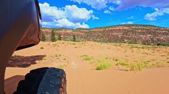 ATV rides through Coral Pink Sand Dunes State Park at sunset