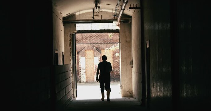Men walking out of craft beer factory brewery in slow motion