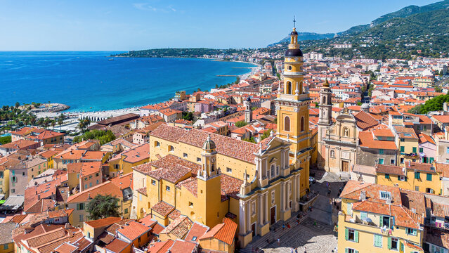 Aerial drone view of the Basilica of Saint-Michel in the old town of Menton on the coast of the Mediterranean Sea in the French Riviera