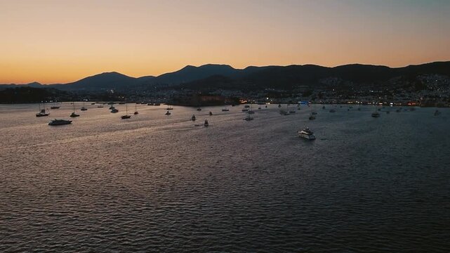 Scenic sunset above Bodrum waterfront and marina on Aegean coast of Turkey. Handheld