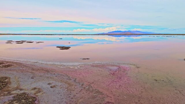 Great Salt Lake's still waters reflect the panoramic landscape from Antelope Island State Park