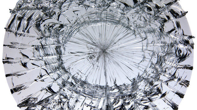 Isolated shattered glass with radiating cracks, broken abstract texture, destruction concept