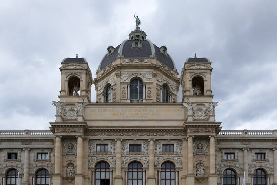 Natural History Museum Vienna with Dome and Helios Statue under Cloudy Sky. 