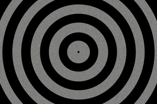 Bold concentric black and white circles forming a precise target-inspired geometric pattern with strong visual contrast.