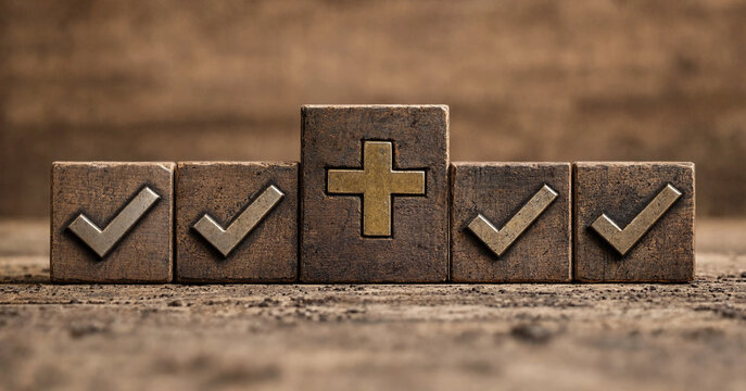 Five wooden blocks featuring four check marks and one plus sign symbol
