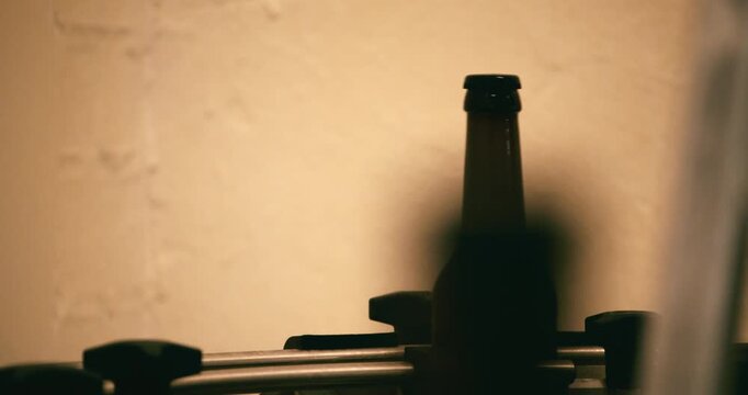 Single beer bottles moving on conveyor belt in brewery Berlin