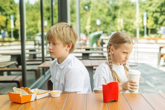 Children Upset With Each Other During Fast Food Restaurant Visit