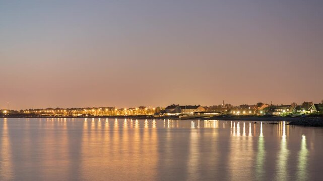 Illuminated Coastal Skyline of Raa Sweden at Dusk