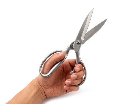 Human hand holding opened steel scissors isolated on white background cutting office stationary tool