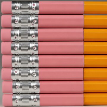 Colorful pencils with metallic ferrules arranged in rows.