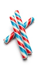 Obraz premium Colorful striped candy canes on white background.