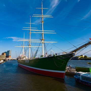 HAMBURG, GERMANY - AUGUST 26, 2026 - Historic Rickmer Rickmers moored with Elbphilharmonie in background, a popular tourist attraction