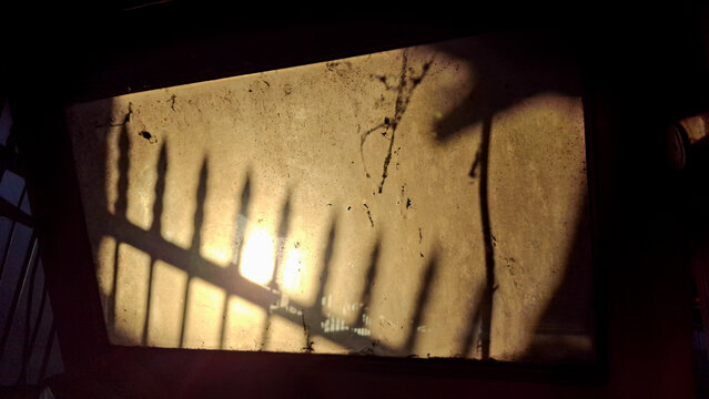  silhouette sun light through dirty window