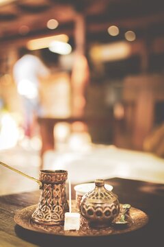 Turkish coffee set up candy with toothpick in Bosnian restaurant with weiter at the bar. Tourism and traditional drinks in bosnia. Background image. Istanbul.Turkey