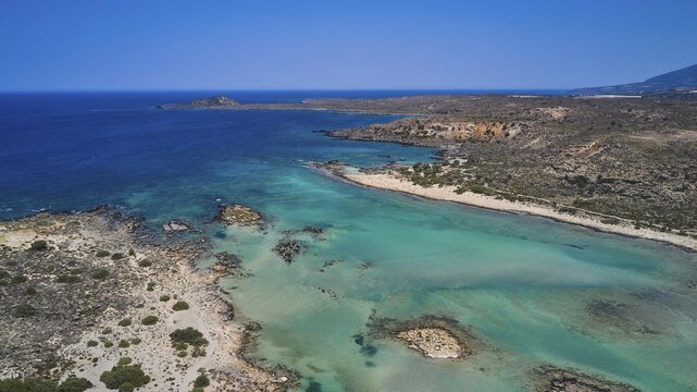 A beautiful coastline with clear waters, cliffs and a beach that displays natural beauty, Elafonissi, lagoon, south-west tip of Crete, Crete, Greek Islands, Greece