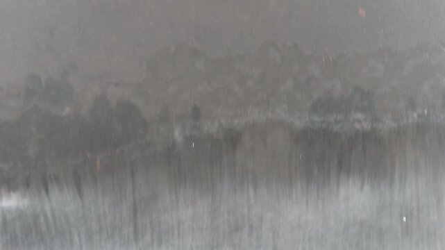 snow covered lake with waterfall