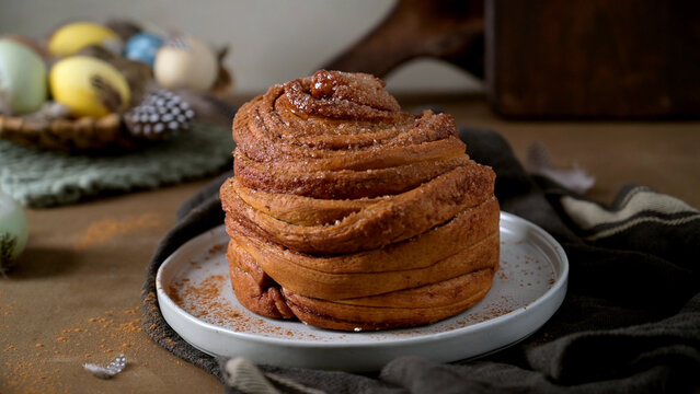 Fresh Cinnamon Roll with Easter Eggs and Spring Decor