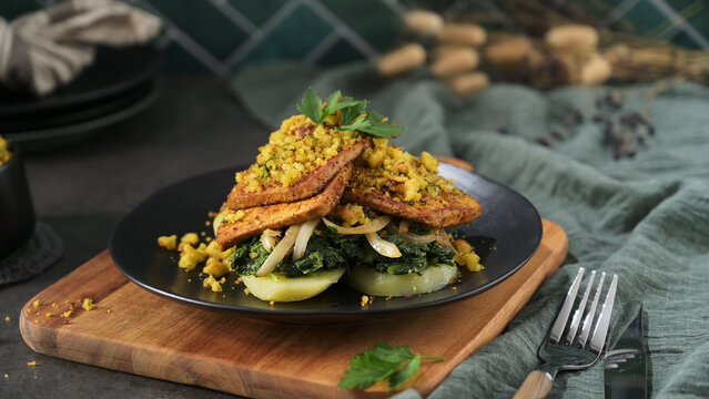 Pan-Seared Tofu with Saut&eacute;ed Spinach and Potatoes Topped with Herb Crumbles