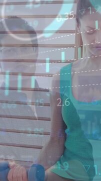 Composite of financial data processing over woman exercising