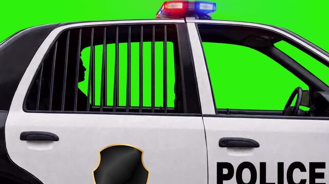 Man in back of police car green screen