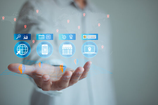 Businessman holding a local SEO icon with AI for local search, online marketing optimization, business strategy, digital promotion, and customer targeting in modern technology.