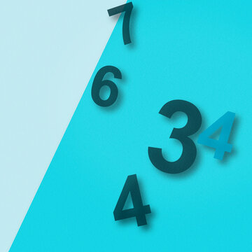Deep, shadowed numerals drift across a teal split background, creating a cool, focused mood for learning tools, counters, and data displays.