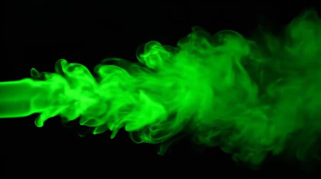 Green smoke plume expanding in dark space