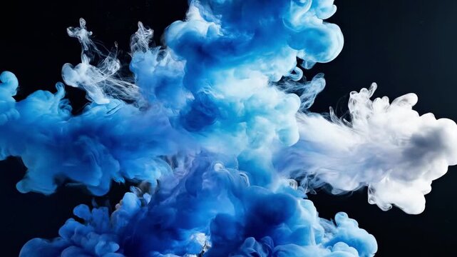 Blue and white ink explosion on black background.