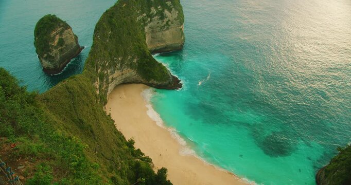 Turquoise ocean water and steep cliffs at Kelingking beach Nusa Penida Bali